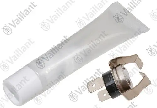 Vaillant Sicherheitstemperaturbegrenzer, bestehend aus einem Metallgehäuse mit zwei Anschlusspins und einer Tubenpackung, möglicherweise für Montage oder Wartung.